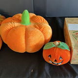 Assorted Halloween decor: plush pumpkins, cow-patterned cushion, and vintage candle box - thumbnail 3 of 6
