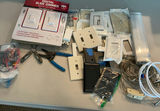Assorted lighting switches, dimmers, wall plates, and wiring hardware - thumbnail 1 of 5
