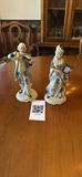 Pair of blue-and-white porcelain figurines: man with violin and woman with instrument - thumbnail 1 of 5