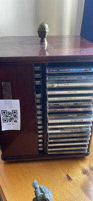 Wooden Cds storage cabinet with numerous tapes - Image 1 of 4