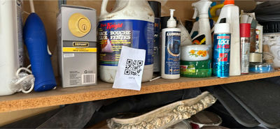 Shelf with paints, cleaners, and hardware - Image 1 of 4