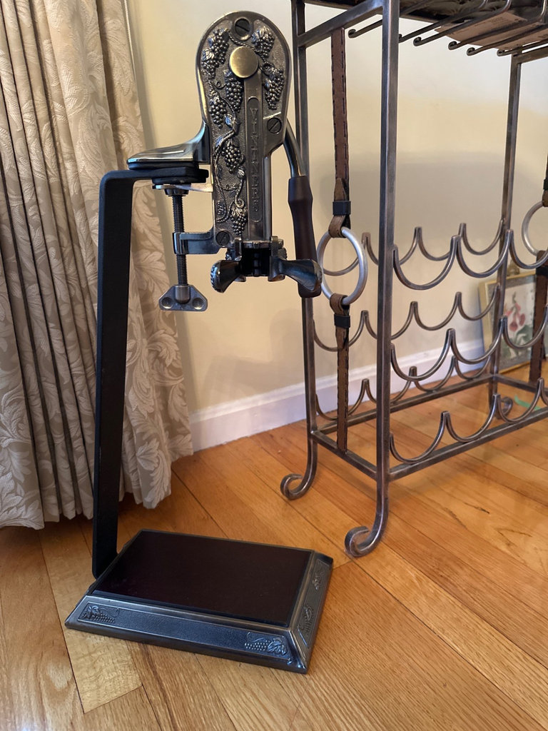 Vintage lever-style wine opener on decorative stand with wine rack - image 1 of 6