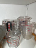 Kitchenware collection: measuring cups, jars, bakeware, and a handheld mixer - thumbnail 5 of 7