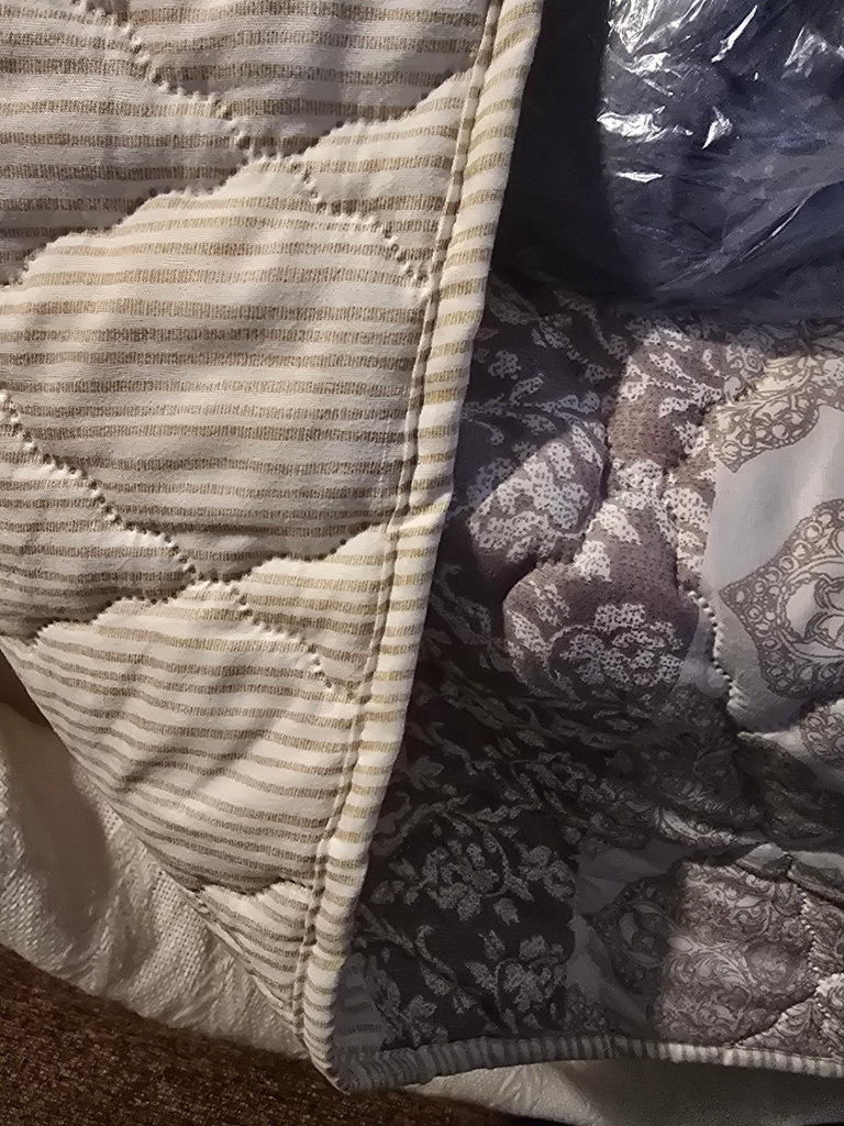 Stacked quilts and blankets - image 3 of 8