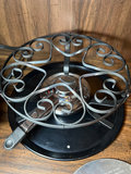 Vintage kitchenware collection: glass segmented serving tray, ceramic pot on burner stand, carved wooden serving piece, and metal scroll trivet - thumbnail 5 of 6