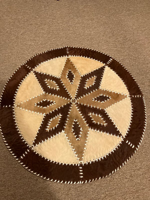 Round brown stitched pouf rug - Image 1 of 2