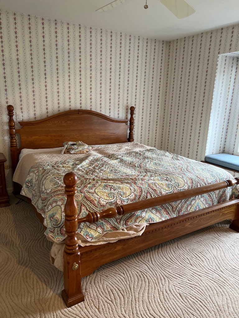 Wooden four-poster king bed frame - image 1 of 4