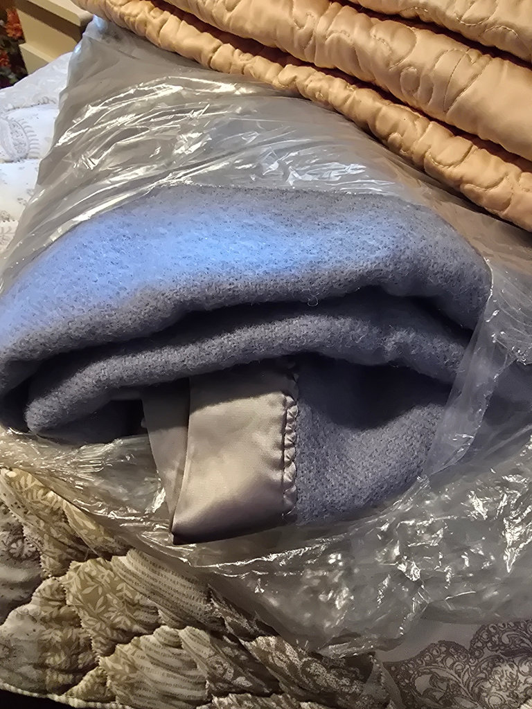 Stacked quilts and blankets - image 6 of 8