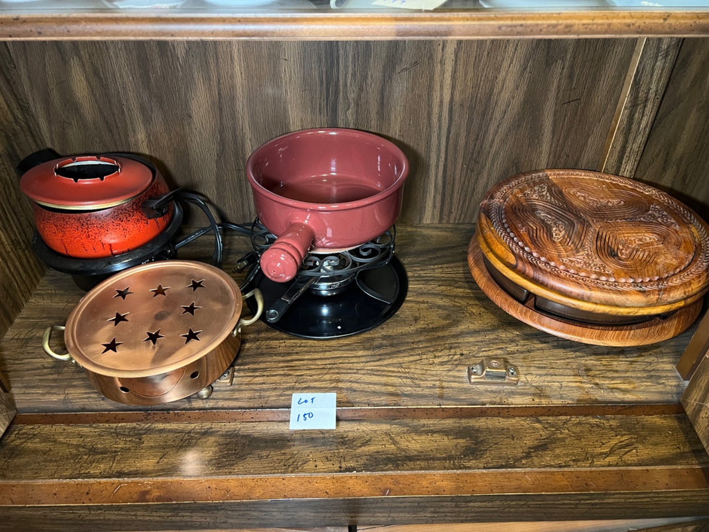 Vintage kitchenware collection: glass segmented serving tray, ceramic pot on burner stand, carved wooden serving piece, and metal scroll trivet - image 1 of 6
