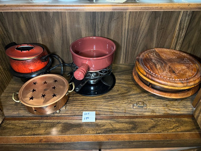 Vintage kitchenware collection: glass segmented serving tray, ceramic pot on burner stand, carved wooden serving piece, and metal scroll trivet - Image 1 of 6
