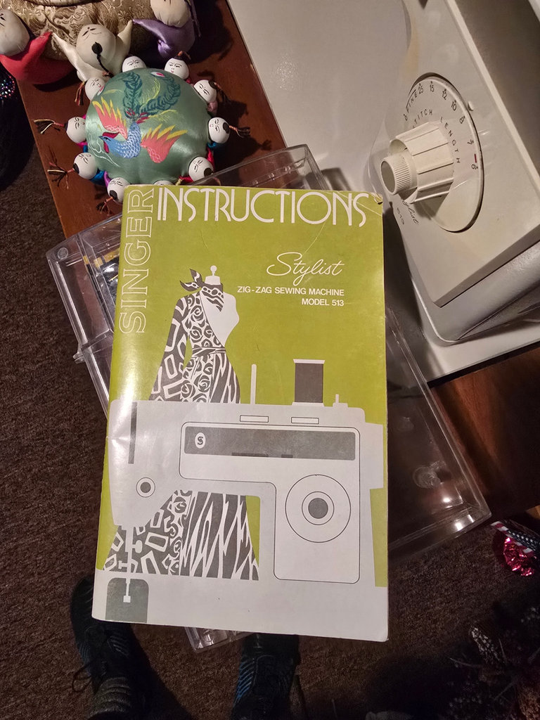 Singer sewing machine with knitting books and craft supplies - image 5 of 21