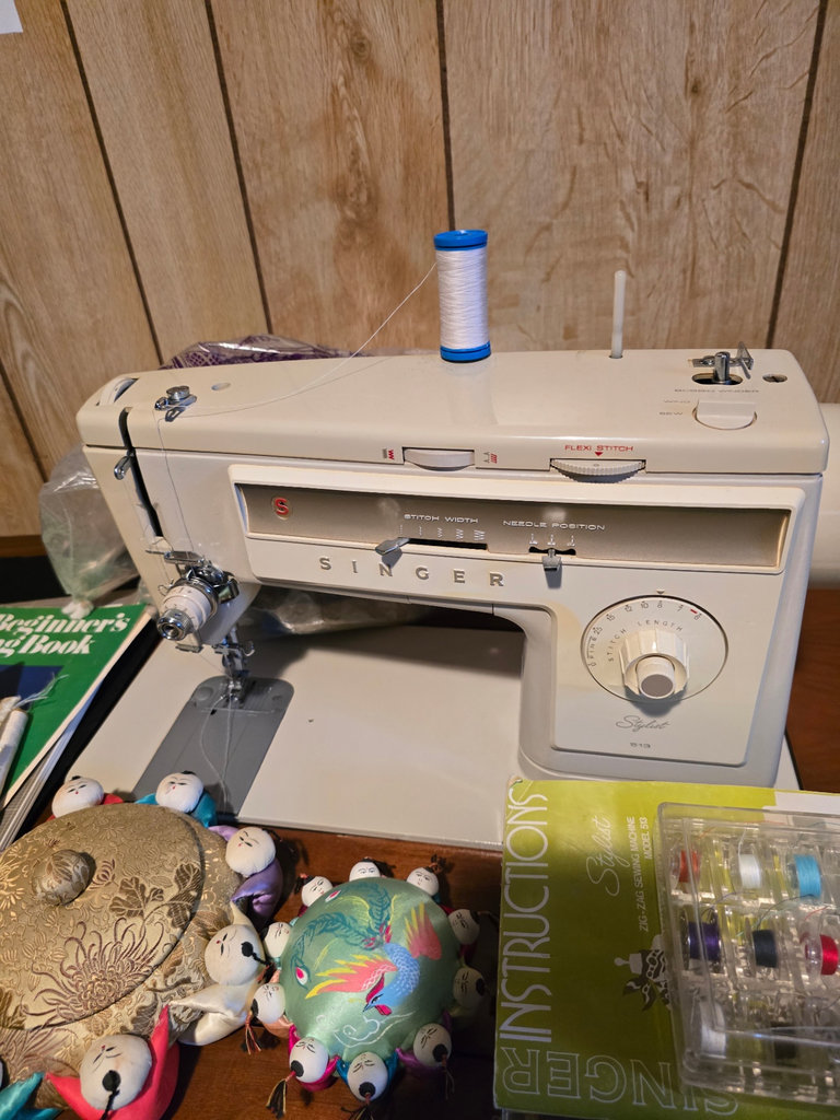 Singer sewing machine with knitting books and craft supplies - image 2 of 21