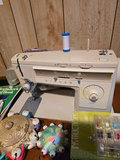 Singer sewing machine with knitting books and craft supplies - thumbnail 2 of 21