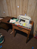 Singer sewing machine with knitting books and craft supplies - thumbnail 1 of 21