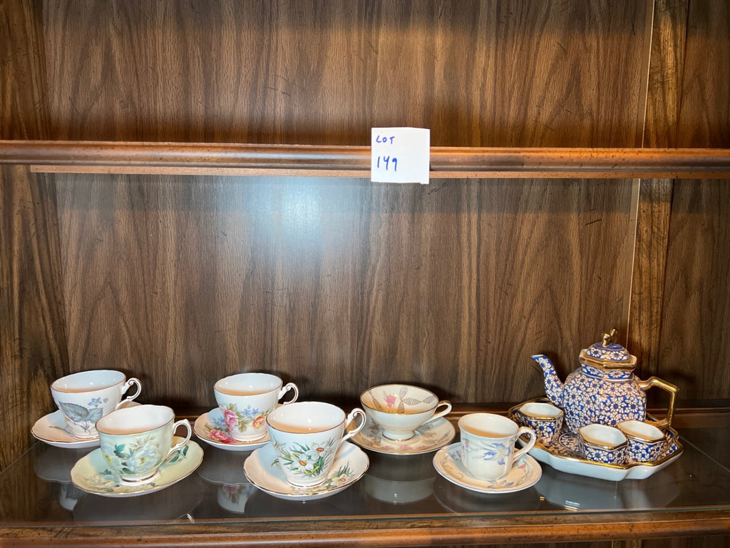 Porcelain tea set with blue and floral designs - image 1 of 10