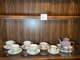 Porcelain tea set with blue and floral designs - thumbnail 1 of 10