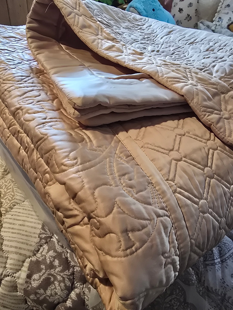 Stacked quilts and blankets - image 4 of 8