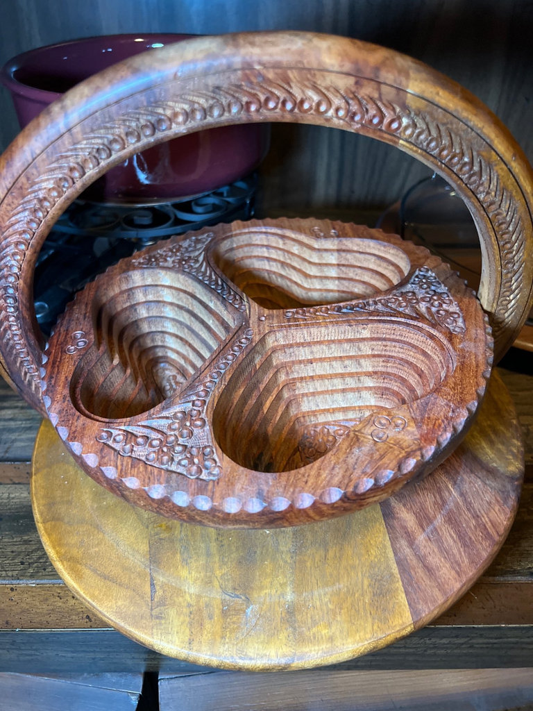 Vintage kitchenware collection: glass segmented serving tray, ceramic pot on burner stand, carved wooden serving piece, and metal scroll trivet - image 4 of 6