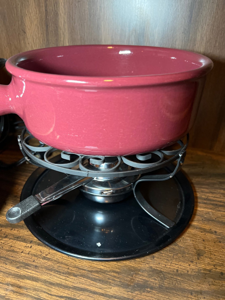 Vintage kitchenware collection: glass segmented serving tray, ceramic pot on burner stand, carved wooden serving piece, and metal scroll trivet - image 3 of 6