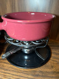 Vintage kitchenware collection: glass segmented serving tray, ceramic pot on burner stand, carved wooden serving piece, and metal scroll trivet - thumbnail 3 of 6