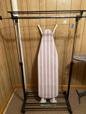 Freestanding ironing board on metal clothes rack - Image 1 of 6