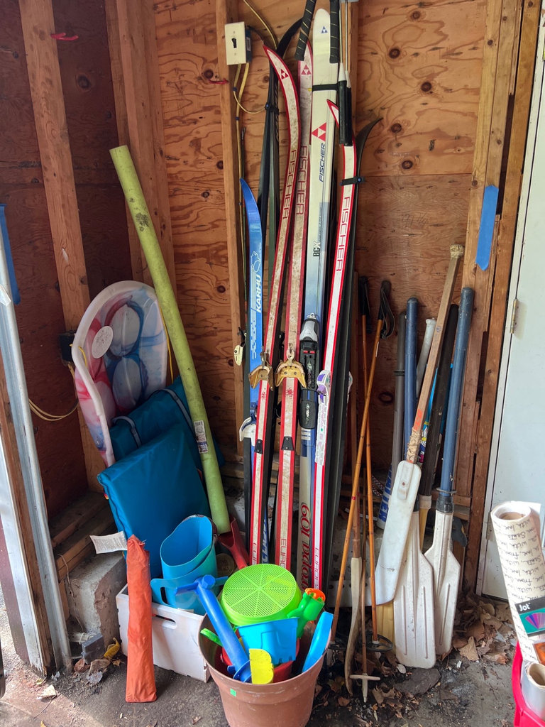 Ski equipment with poles and assorted outdoor gear - image 1 of 6