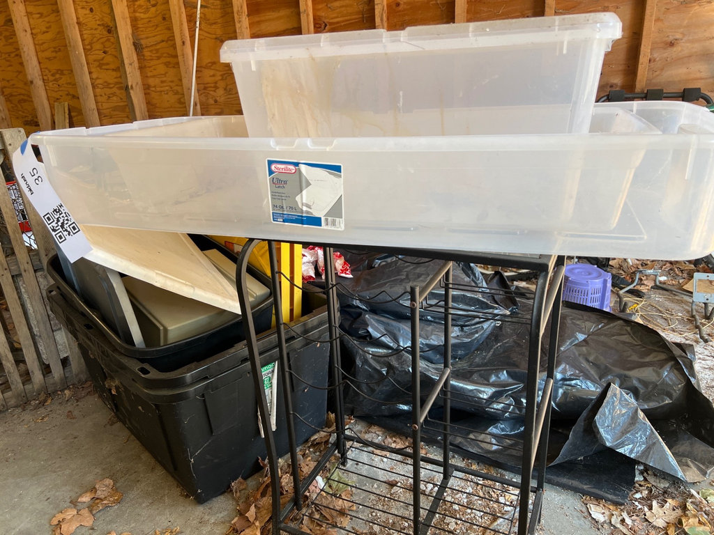 Metal wire-frame wine rack with glass top and assorted plastic storage - image 1 of 7