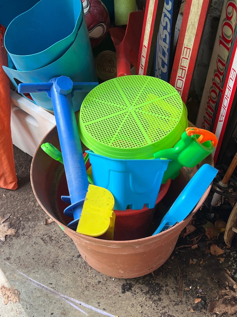 Ski equipment with poles and assorted outdoor gear - image 2 of 6