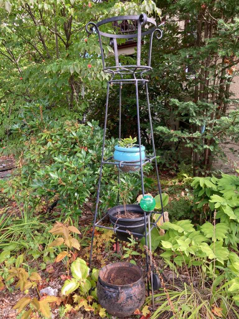 metal plant stand with pots - image 1 of 2
