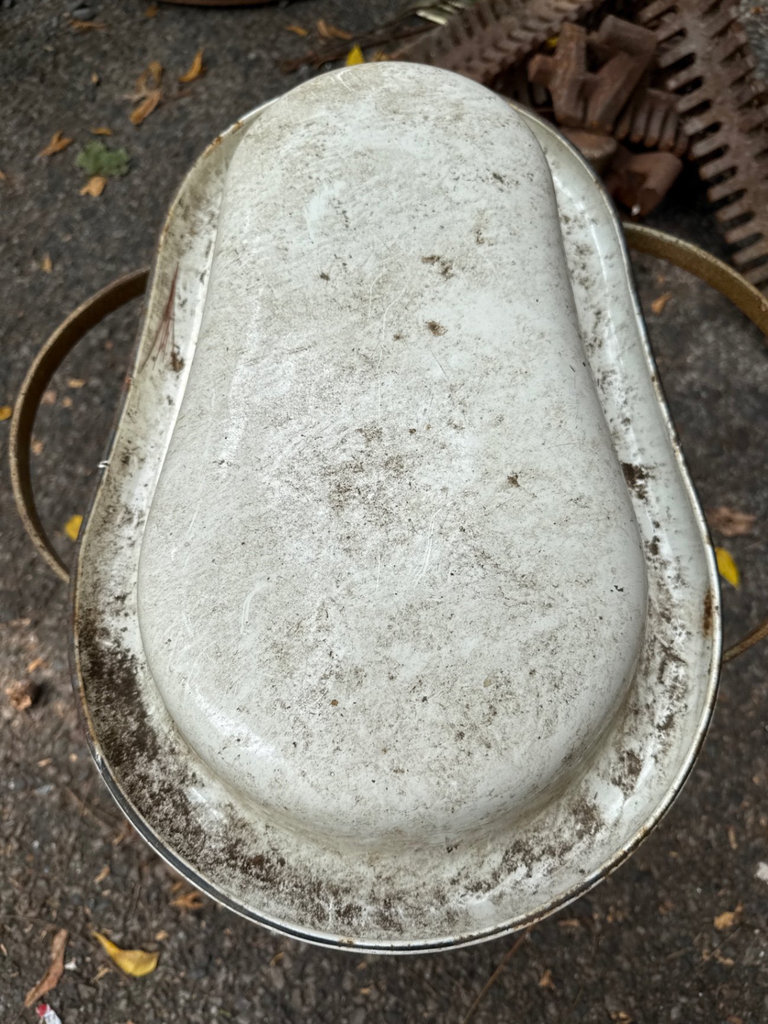 Weathered enamel infant tub basin on rusted folding stand - image 3 of 9