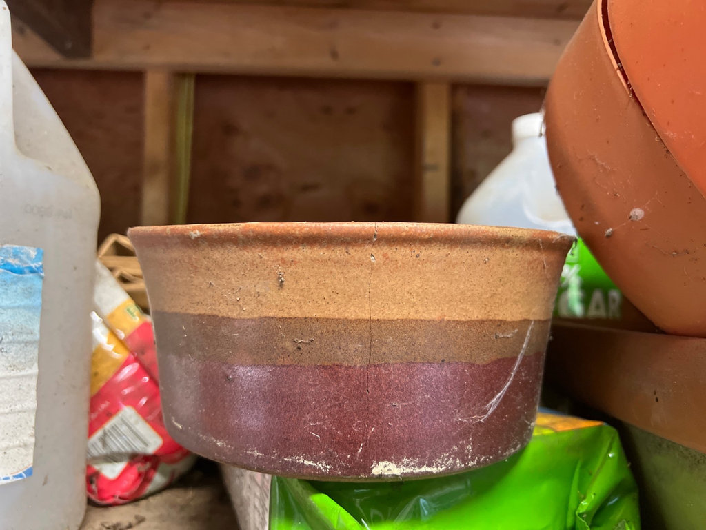 Assorted yard and garden items: planters, plant food, and a basketball - image 8 of 10