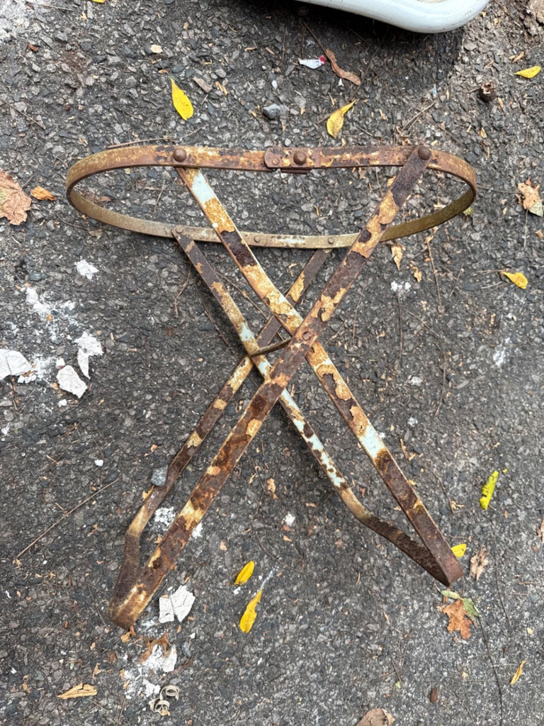 Weathered enamel infant tub basin on rusted folding stand - image 5 of 9