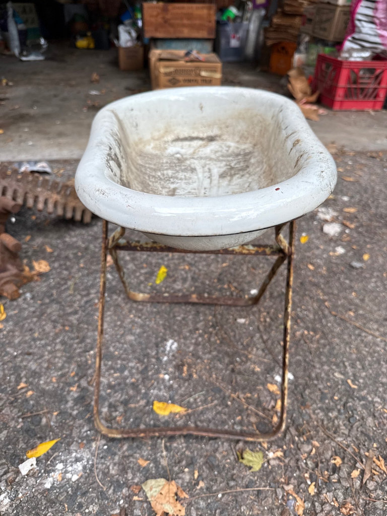 Weathered enamel infant tub basin on rusted folding stand - image 2 of 9