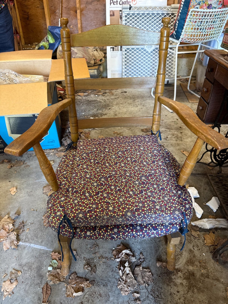 Vintage wooden armchair with star-pattern upholstery and tiltable seat - image 1 of 9
