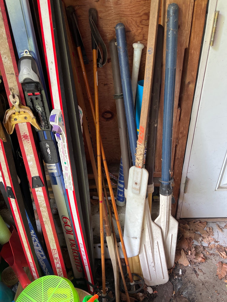 Ski equipment with poles and assorted outdoor gear - image 4 of 6