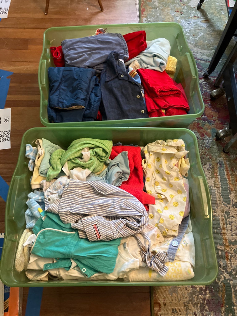 Assorted vintage children’s clothing in storage bins - image 1 of 5
