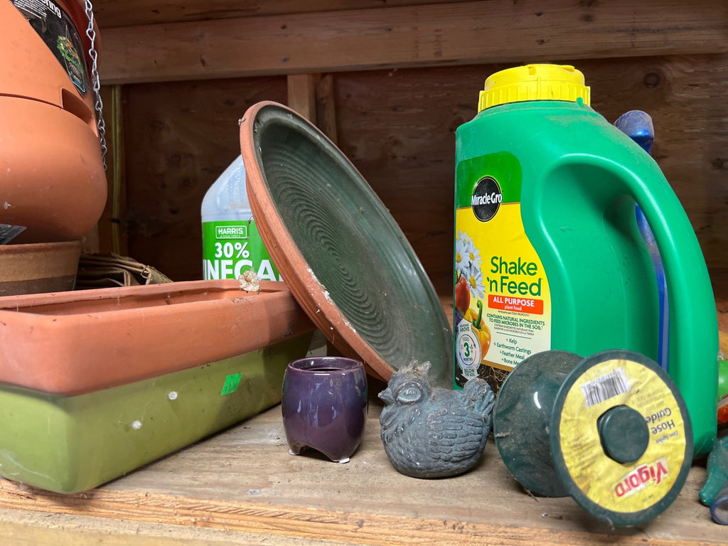 Assorted yard and garden items: planters, plant food, and a basketball - image 5 of 10