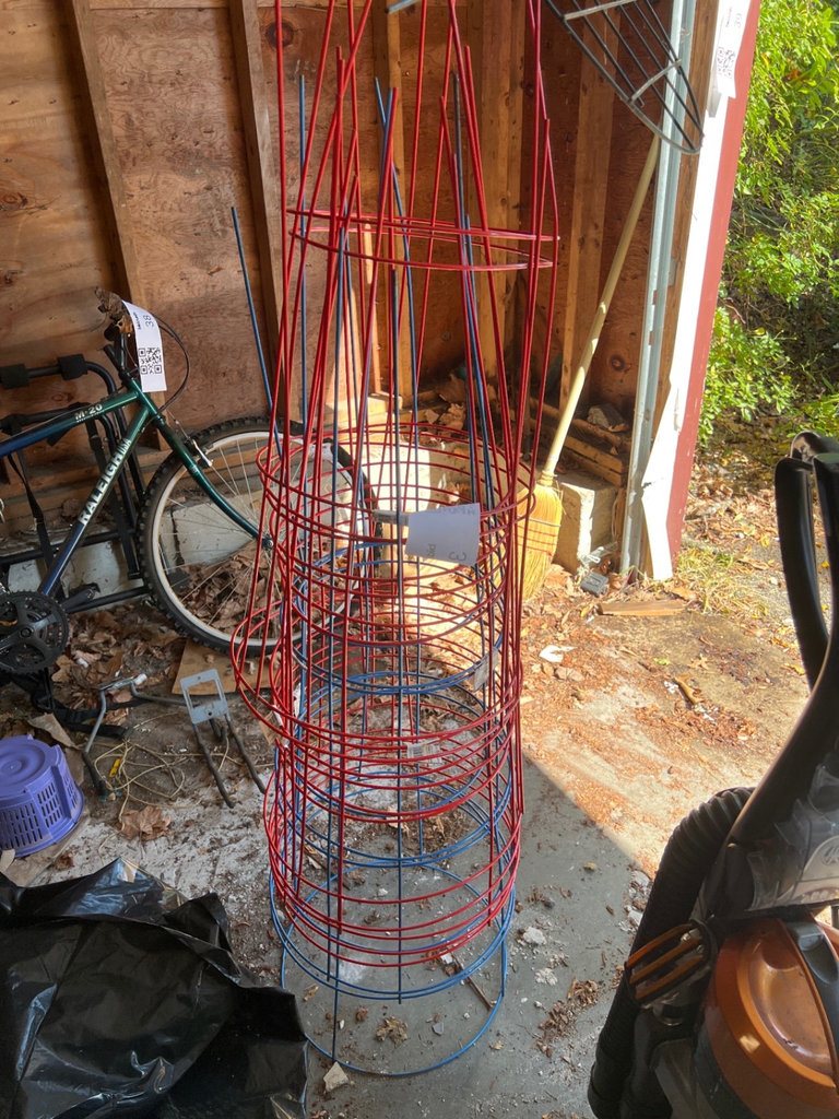 Red and blue metal tomato cages - image 1 of 3