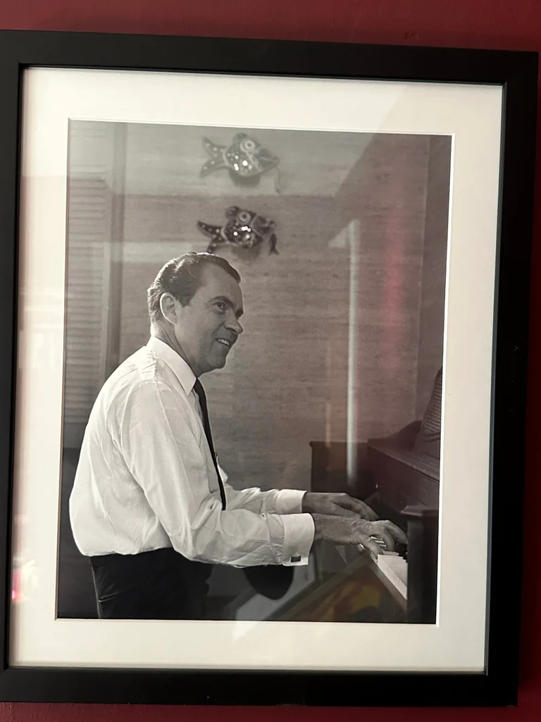 Framed Black and White Photograph of Richard Nixon playing the piano - image 1 of 2