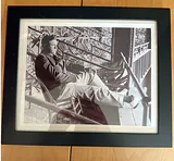 Black and White Photograph of Clark Gable reclining in a chair - thumbnail 1 of 2