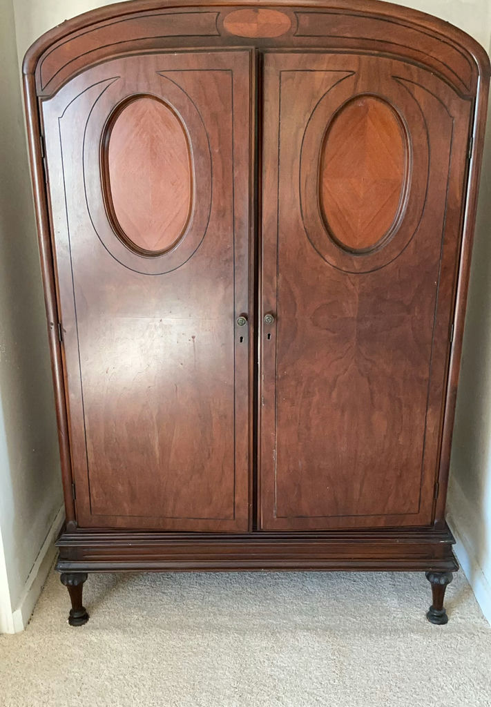 Antique wooden armoire with built-in drawers Antique wooden armoire with built-in drawers