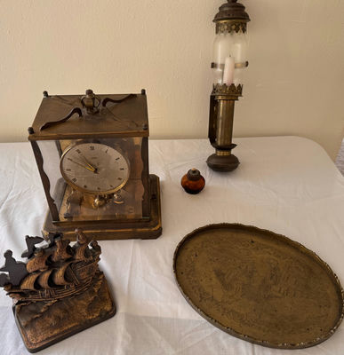 Antique mantel clock, lantern lamp, engraved tray, ship sculpture, angel candlesticks, and alcohol lamp bottle - Image 1 of 8