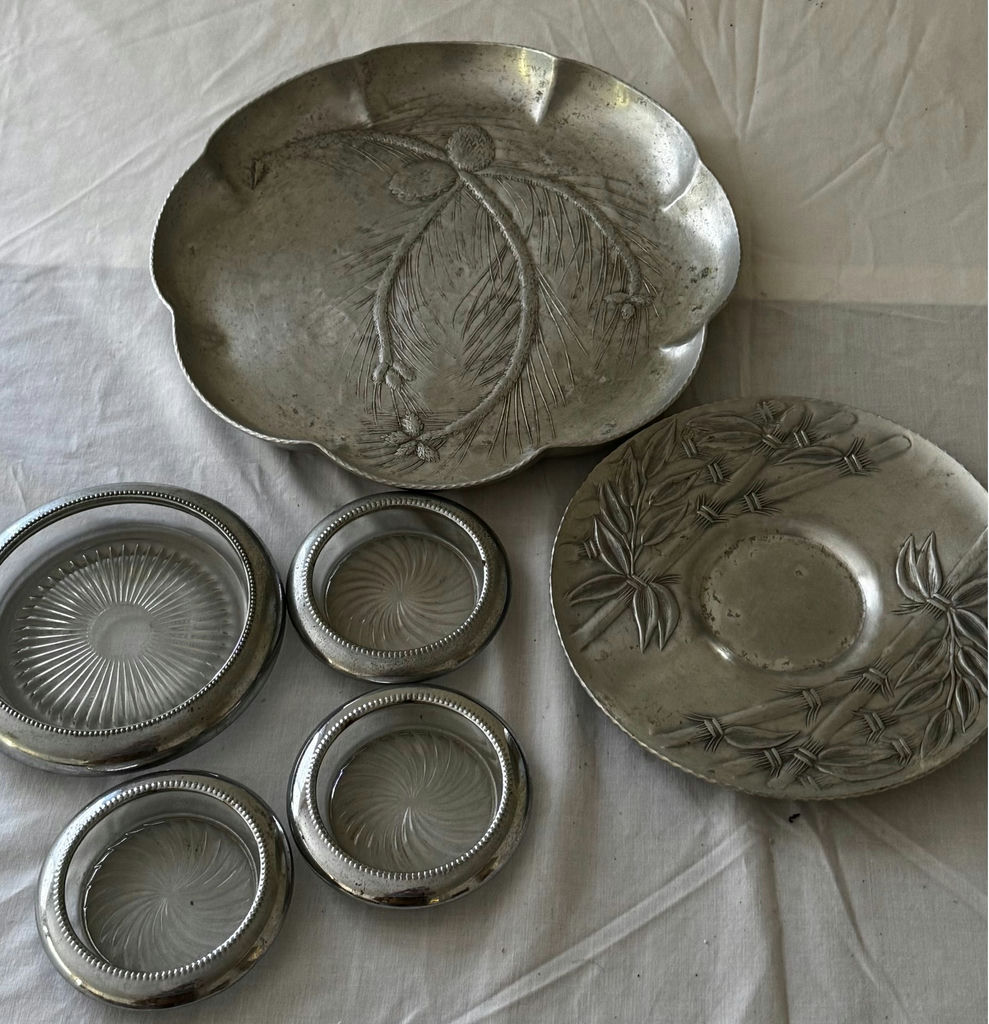 Two pressed aluminum plates with a tropical theme, and silver plate and cut glass coasters. - image 2 of 3