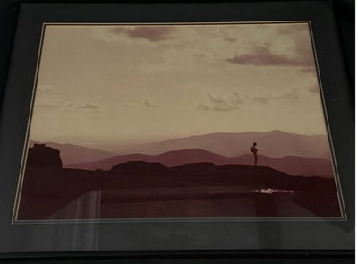 Framed landscape photograph with lone figure - Image 1 of 4