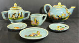 Teal-blue glazed ceramic tea service with hand-painted figures and cactus motifs - thumbnail 1 of 12