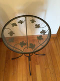 Round glass-top metal end table with ivy leaf motif - thumbnail 1 of 2