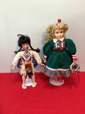 Two decorative dolls in traditional-style clothing - thumbnail 1 of 3