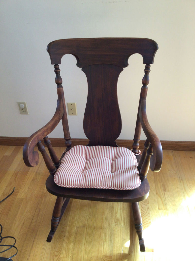 Wooden rocking chair with striped cushion - image 1 of 2
