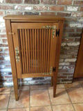Wooden cabinet with slatted vent-style door - thumbnail 1 of 3