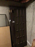 Black grid-pane door with window frame and plywood panel - thumbnail 3 of 3